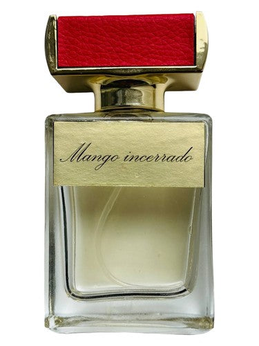 Kamila Robinson Mango encerrado fragrance bottle