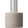 Osaji beside fragrance bottle