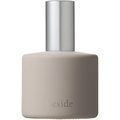 Osaji beside fragrance bottle