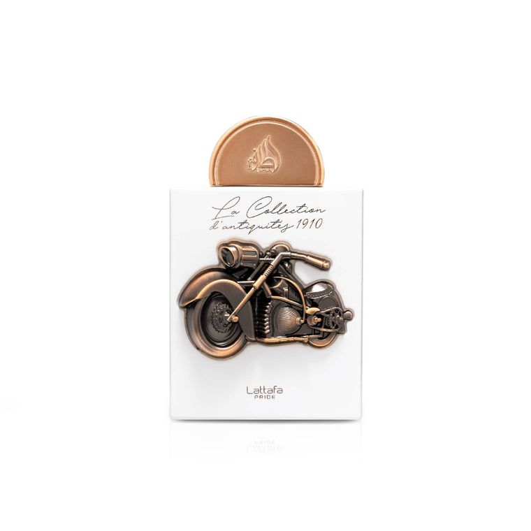 Lattafa Pride La Collection d’Antiquités 1910 Eau de Parfum bottle with bronze motorcycle relief on a white background